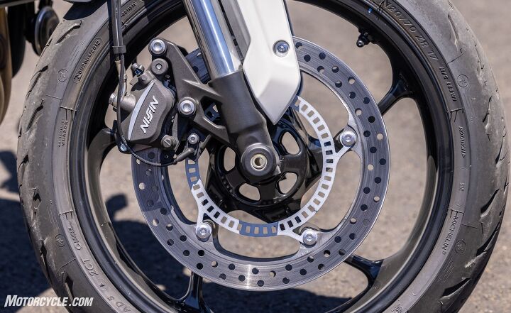 2021 triumph trident review first ride, The 310mm discs bolt right up to the wheel spokes a weight saving thing we first saw on expensive BMWs a few years ago Maybe more than a few years ago Teflon brake lines are a small thing that make a big difference in feel