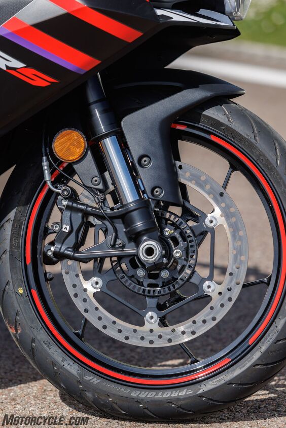 A 320mm disc, radial caliper, and steel lines are a great thing to see on an entry-level bike. Note also the Aprilia-branded tires. For our track test, Aprilia fitted Pirelli Supercorsa SP V4 rubber on each bike.