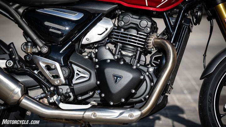 Veiled in “modern classic” styling, the TR mill is thoroughly modern despite its faux fins. The radiator snugged up at the front of the frame rails hints to what other tricks might be up the Speed’s DLC-coated sleeves.