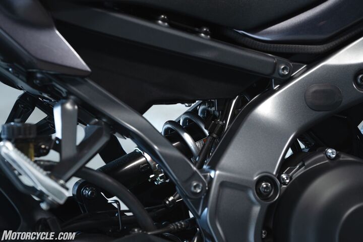 The shock is the same as last year, but is mated to a new linkage, which you can hardly see at the bottom of this photo. Though out of focus, you can clearly see the new subframe, including the repositioned mounting points for the passenger pegs on the bottom of the spar instead of on the side.