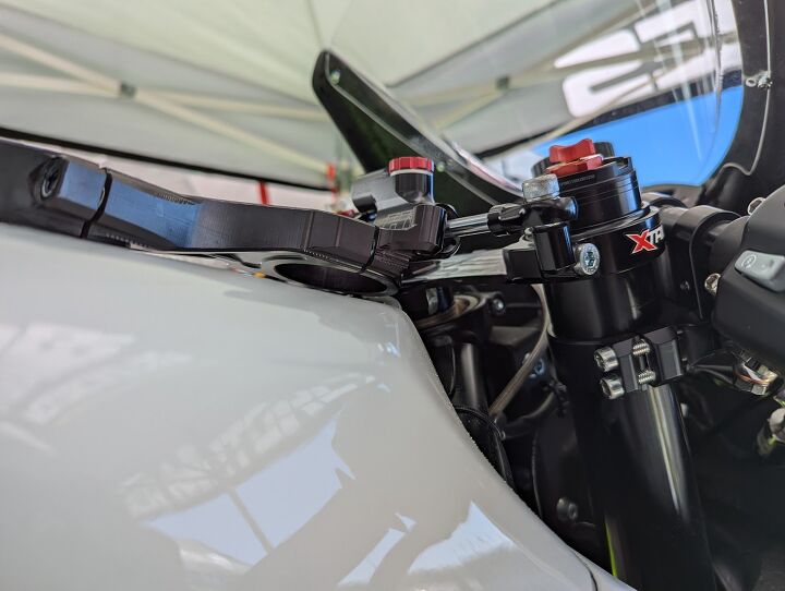 Be careful what you wish for: after complaining about constant chatter and a lack of chassis flex, Felix replaced the standard top triple clamp (left) with a prototype piece. Both are XTrig pieces, and the one currently mounted started its life like the one propped up on the tank. Look close and you’ll see the one being used has been machined down to the thickness of a credit card!