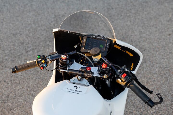 The cockpit of the APX-350 is all racebike, with buttons on the left and a race-specific dash. Note the hash marks on the clip-on tubes to precisely measure bar placement. There are additional hash marks on the triple clamp to place the bars at the same angle on both sides as well.