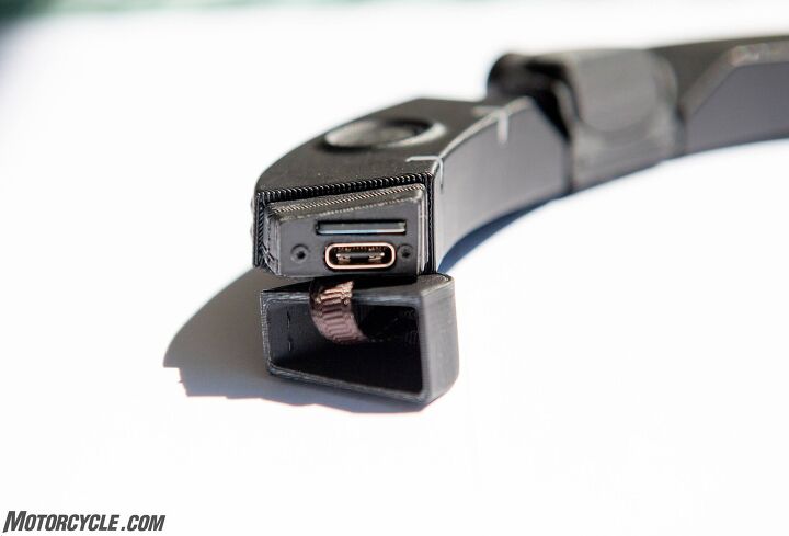 mo tested cambox mkv4 pro action camera, With the cover open you can see the slots for the memory card and charge port With a flexible cord charging is possible without having to remove it from your helmet
