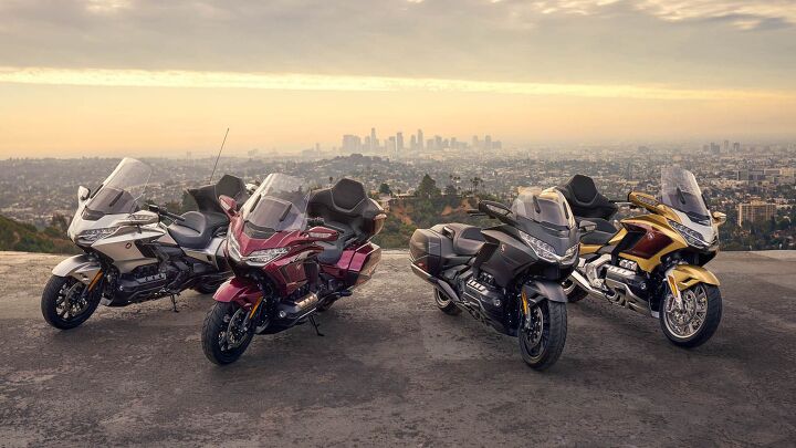 From left to right, the Gold Wing Tour in Light Silver Metallic, the Gold Wing Tour in Bordeaux Red Metallic, the Gold Wing in Matte Black Metallic, and the Gold Wing Tour Eternal Gold. All but the silver color are considered 50th Anniversary editions.