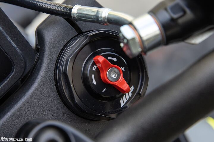 Adjusting damping on the fork is a toolless affair, while a standard screwdriver and spanner are required to adjust the shock character.