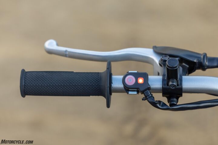 The instruments included a big glowing kill switch (on the left side next to the grip), a fuel warning light, an engine warning light, and an electric start switch. No speedometer, tachometer, or gear indicator. This baby is bare bones, basic.